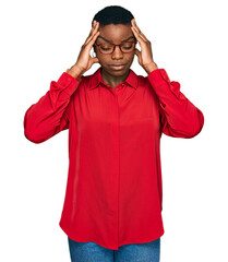 Sticker - Young african american woman wearing casual clothes and glasses suffering from headache desperate and stressed because pain and migraine. hands on head.