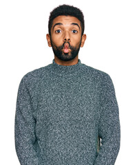 Canvas Print - Young african american man wearing casual clothes making fish face with lips, crazy and comical gesture. funny expression.