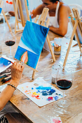 Wall Mural - Art and Wine Workshop. Wine-Stained Brushes: Women Craft Masterpieces in Art and Wine