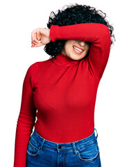 Poster - Young middle east girl wearing casual clothes and glasses covering eyes with arm smiling cheerful and funny. blind concept.