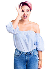 Poster - Young beautiful woman with pink hair wearing casual clothes doing ok gesture with hand smiling, eye looking through fingers with happy face.