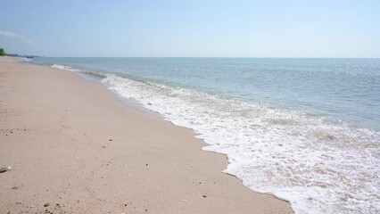 Wall Mural - slow motion scene, beautiful landscape of sea coast view on sand beach