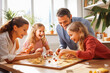 © VisualProduction - Family playing board game. Family spending time together playing board game. Generative AI
