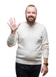 © Krakenimages.com - Young caucasian hipster man wearing winter sweater over isolated background showing and pointing up with fingers number five while smiling confident and happy.