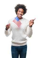 Wall Mural - afro american man flag of united states of america over isolated background very happy pointing with