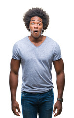 Sticker - Afro american man over isolated background afraid and shocked with surprise expression, fear and excited face.