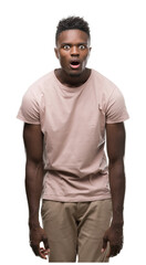 Poster - Young african american man scared in shock with a surprise face, afraid and excited with fear expression