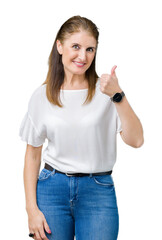 Poster - Middle age mature beautiful woman over isolated background doing happy thumbs up gesture with hand. Approving expression looking at the camera with showing success.