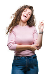 Poster - Beautiful brunette curly hair young girl wearing pink sweater over isolated background smiling with happy face winking at the camera doing victory sign. Number two.