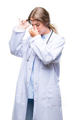 Sticker - Beautiful young blonde doctor woman wearing medical uniform over isolated background tired rubbing nose and eyes feeling fatigue and headache. Stress and frustration concept.