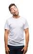 © Krakenimages.com - Young handsome man over isolated background making fish face with lips, crazy and comical gesture. Funny expression.
