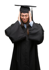 Sticker - Young hispanic woman wearing graduated cap and uniform suffering from headache desperate and stressed because pain and migraine. Hands on head.