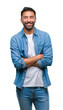 © Krakenimages.com - Adult hispanic man over isolated background happy face smiling with crossed arms looking at the camera. Positive person.