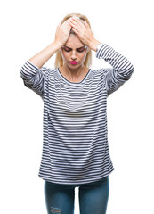 Sticker - Young beautiful blonde woman wearing stripes sweater over isolated background suffering from headache desperate and stressed because pain and migraine. Hands on head.