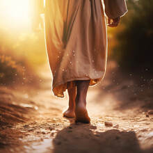 Closeup Of Jesus Walking Alone On An Old Pathway Outside.