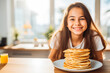 happy little girl eating breakfast pancakes. Healthy breakfast in the morning. Child eating breakfast. Generative AI