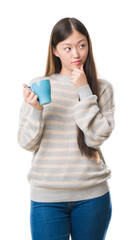 Poster - Young Chinese woman over isolated background driking cup of coffee serious face thinking about question, very confused idea