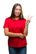 © Krakenimages.com - Young beautiful caucasian woman over isolated background smiling with happy face winking at the camera doing victory sign. Number two.