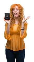 Canvas Print - Young redhead woman holding passport of United States of America very happy and excited, winner expression celebrating victory screaming with big smile and raised hands