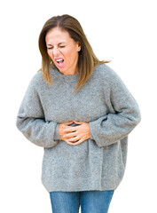 Canvas Print - Beautiful middle age woman wearing winter sweater over isolated background with hand on stomach because indigestion, painful illness feeling unwell. Ache concept.