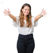 © Krakenimages.com - Young beautiful brunette business woman over isolated background looking at the camera smiling with open arms for hug. Cheerful expression embracing happiness.