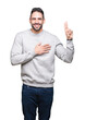 © Krakenimages.com - Young handsome man wearing sweatshirt over isolated background Swearing with hand on chest and fingers, making a loyalty promise oath