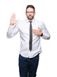 © Krakenimages.com - Young handsome business man wearing glasses over isolated background Swearing with hand on chest and open palm, making a loyalty promise oath