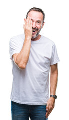 Poster - Middle age hoary senior man wearing white t-shirt over isolated background covering one eye with hand with confident smile on face and surprise emotion.