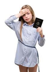 Sticker - Young blonde toddler holding american passport stressed with hand on head, shocked with shame and surprise face, angry and frustrated. Fear and upset for mistake.