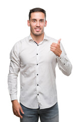 Sticker - Handsome young business man happy with big smile doing ok sign, thumb up with fingers, excellent sign