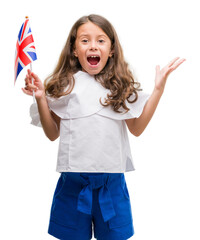 Poster - Brunette hispanic girl holding flag of United Kingdom very happy and excited, winner expression celebrating victory screaming with big smile and raised hands