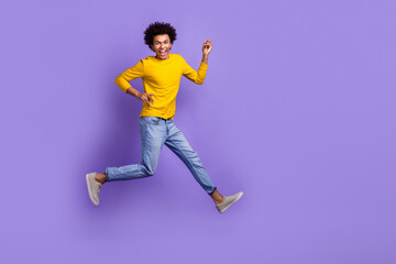 Canvas Print - Full length body photo of jumping crazy overjoyed optimistic funky wear denim jeans yellow shirt isolated on purple color background