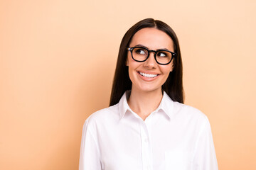 Wall Mural - Photo of young satisfied latin businesswoman wear glasses formal stylish shirt look interested mockup isolated on beige color background