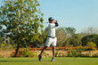 © NVB Stocker - Professinal golf player on golf course. Pro golfer taking a shot