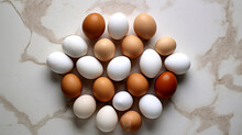 Eggs On White Marble Floor, View From Above. Egg Background. White And Brown Chicken Eggs. Groupe Of Eggs. 