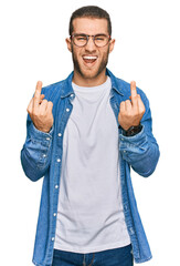 Sticker - Young caucasian man wearing casual clothes showing middle finger doing fuck you bad expression, provocation and rude attitude. screaming excited