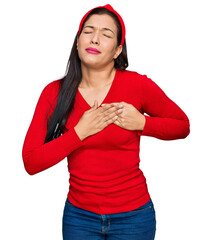 Sticker - Young hispanic woman wearing casual clothes smiling with hands on chest with closed eyes and grateful gesture on face. health concept.