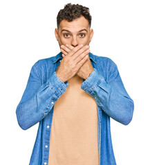 Canvas Print - Young hispanic man wearing casual clothes shocked covering mouth with hands for mistake. secret concept.