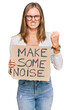© Krakenimages.com - Beautiful blonde woman holding make some noise banner annoyed and frustrated shouting with anger, yelling crazy with anger and hand raised