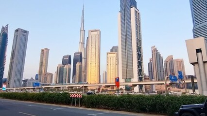 Wall Mural - Dubai, UAE - 06.22.2023 - Traffic on the main road of UAE, Sheikh Zayed road. City