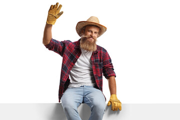 Poster - Farmer with gloves and a straw hat sitting on a panel and waving