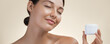 Happy Beauty Spa Woman with Beauty Product in Hand, Perfect Nude Make-Up, Healthy Skin