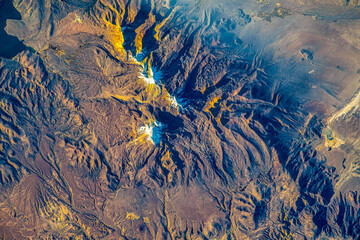 Wall Mural - snowcapped mountains in los andes mountain range, bolivia. digital enhancement of a nasa image