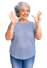 Poster - Senior woman with gray hair wearing casual striped clothes showing and pointing up with fingers number eight while smiling confident and happy.