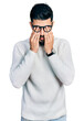 © Krakenimages.com - Young arab man with beard wearing elegant turtleneck sweater and glasses rubbing eyes for fatigue and headache, sleepy and tired expression. vision problem