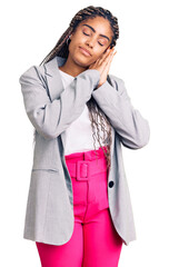 Poster - Young african american woman with braids wearing business clothes sleeping tired dreaming and posing with hands together while smiling with closed eyes.