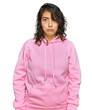 © Krakenimages.com - Young hispanic woman wearing casual sweatshirt depressed and worry for distress, crying angry and afraid. sad expression.