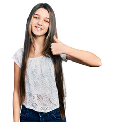 Poster - Young brunette girl with long hair wearing white shirt doing happy thumbs up gesture with hand. approving expression looking at the camera showing success.