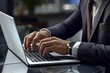 Detail of Businessman's Hand Working on Laptop in Modern Office