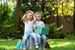 © BillionPhotos.com - Back to school concept. Children learning with books in park.